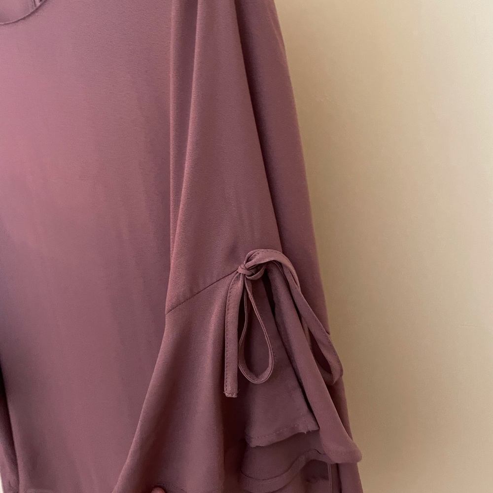 Pink polyester top but feels silky